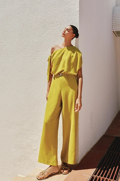 ASYMMETRIC SLEEVE BELTED JUMPSUIT