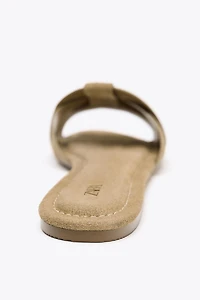 FLAT SUEDE CROSSED SANDALS