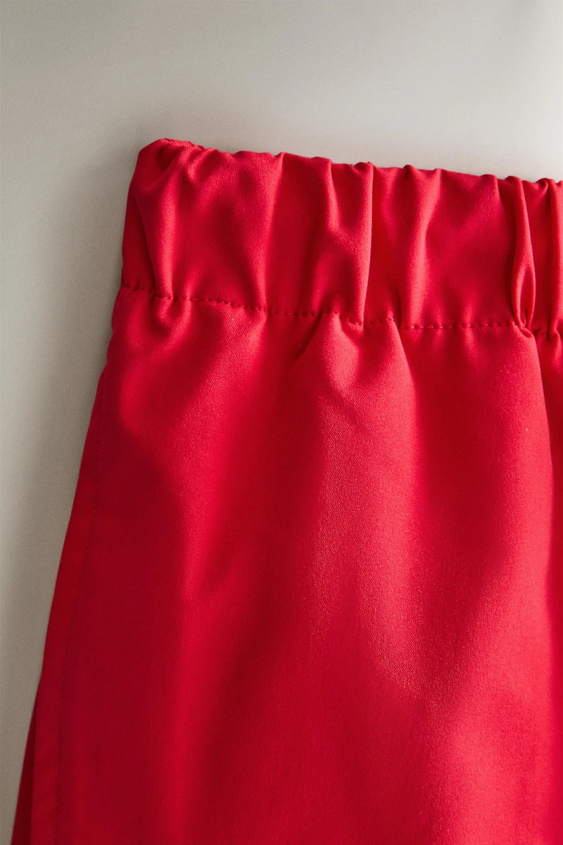 RED MID-LENGTH BEACH SHORTS