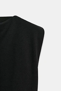 CREPE PEPLUM SHOULDER PAD TOP