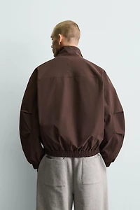 BLOUSON TECHNIQUE COUPE BOXY DÉPERLANT