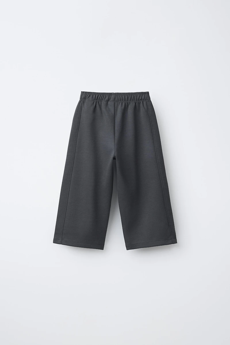 PANTALON WIDE LEG INTERLOCK INSCRIPTION EN RELIEF