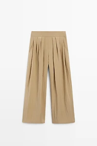 Pantalon palazzo à plis