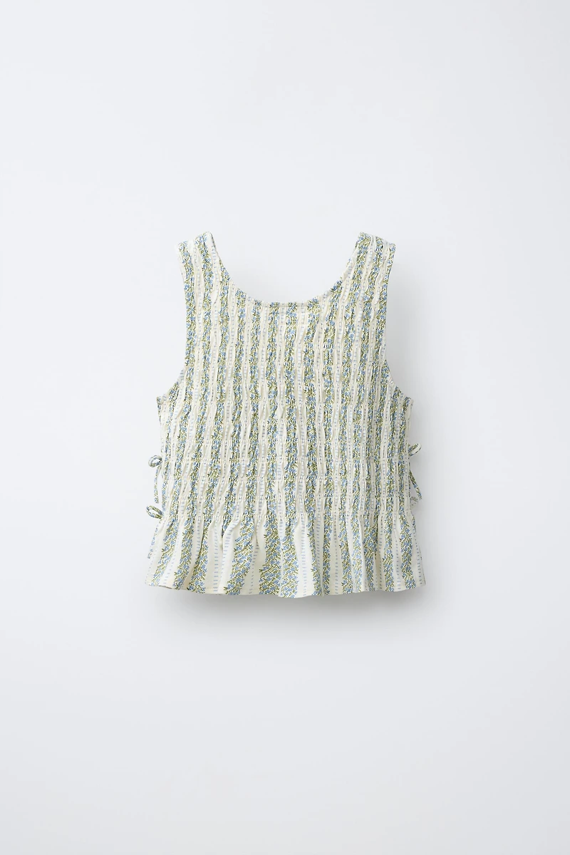 ELASTICIZED TIE TOP