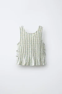 ELASTICIZED TIE TOP