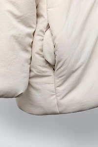 WATER REPELLENT PUFFER COAT WITH BOWS