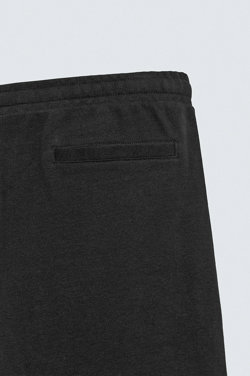 PLEATED WIDE FIT JOGGER PANTS
