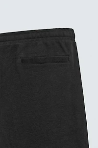 PLEATED WIDE FIT JOGGER PANTS