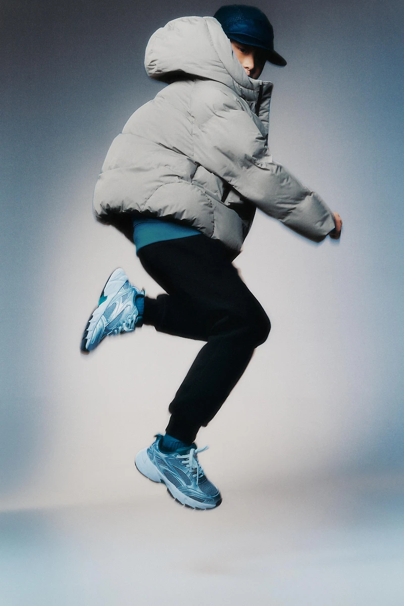 MANTEAU MATELASSÉ ZIPS DÉPERLANT