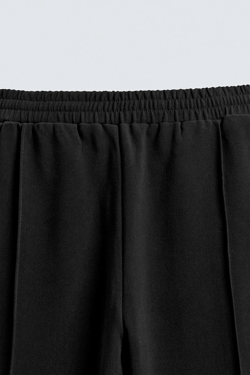 FLOWY ZIPPERED PANTS