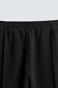 FLOWY ZIPPERED PANTS
