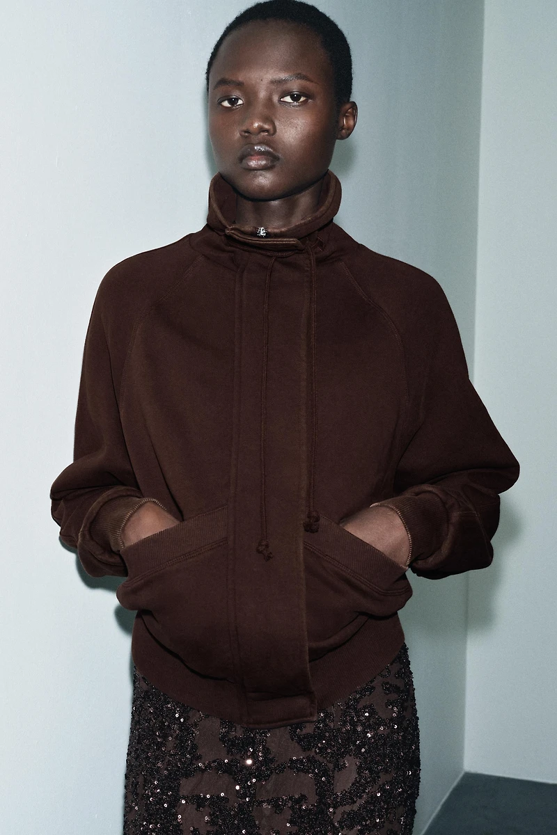 VESTE EN MOLLETON EFFET DÉLAVÉ