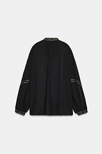 BLOUSE SEMI-TRANSPARENTE À FANTAISIE