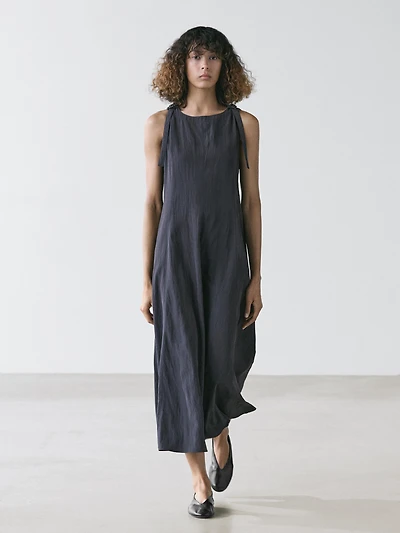Flowing midi dress with buckles
