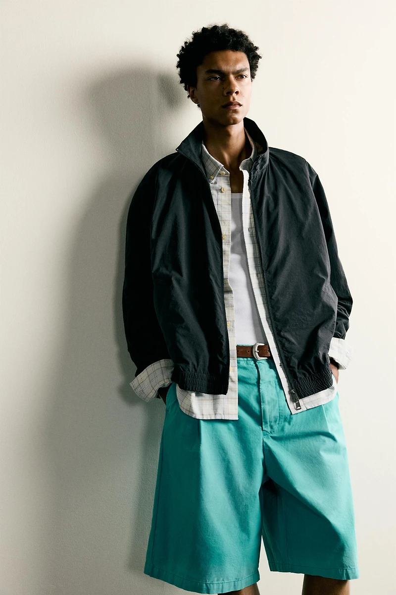 WASHED PLEATED RELAXED FIT SHORTS