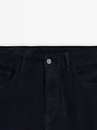 Faux jean en velours côtelé coupe slim