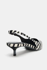 CHAUSSURES EN CUIR À IMPRIMÉ ANIMALIER