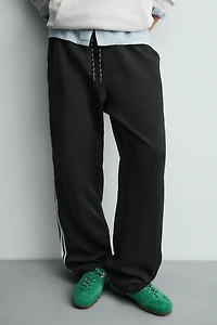 WIDE FIT JOGGER PANTS WITH SIDE STRIPES