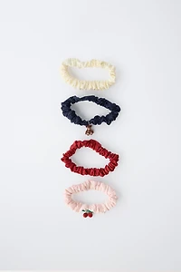 LOT DE QUATRE CHOUCHOUS CHARMS