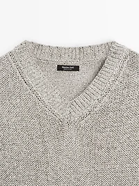 Knit sweater with fabric detail