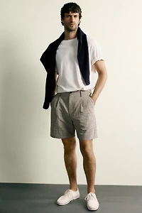 TEXTURED PLAID PLEATED SHORTS