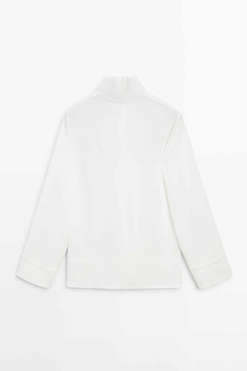 High neck blouse with hem detail