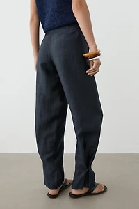 Trousers with gathered hems