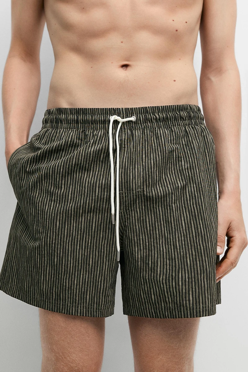 Striped print swimming trunks