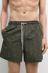 Striped print swimming trunks