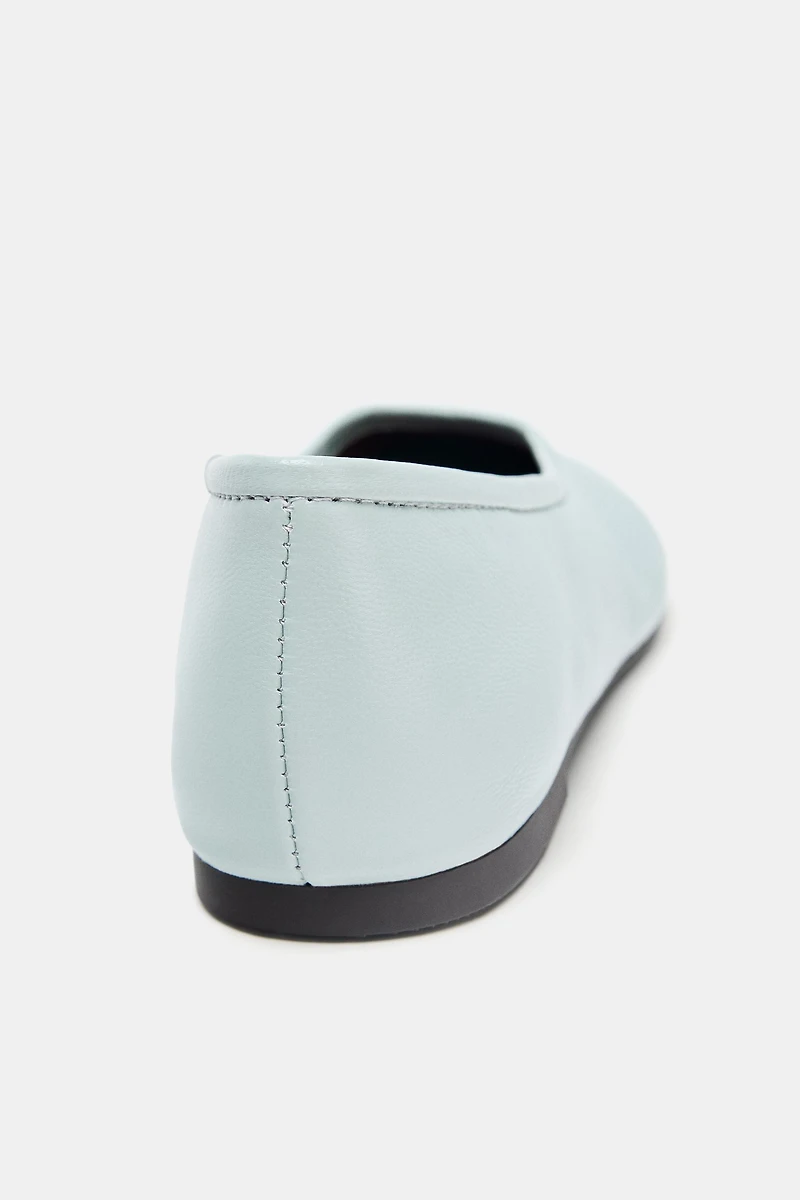 BALLERINES EN CUIR AVEC SURPIQÛRES
