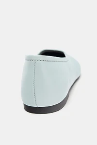 BALLERINES EN CUIR AVEC SURPIQÛRES