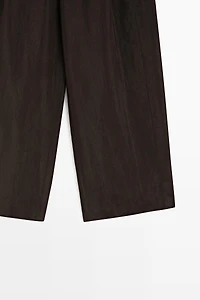 Wide-leg flowing trousers with darts
