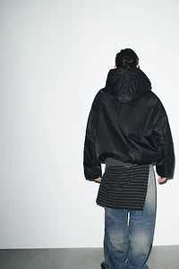 VESTE MATELASSÉE À CAPUCHE DÉPERLANTE ET COUPE-VENT