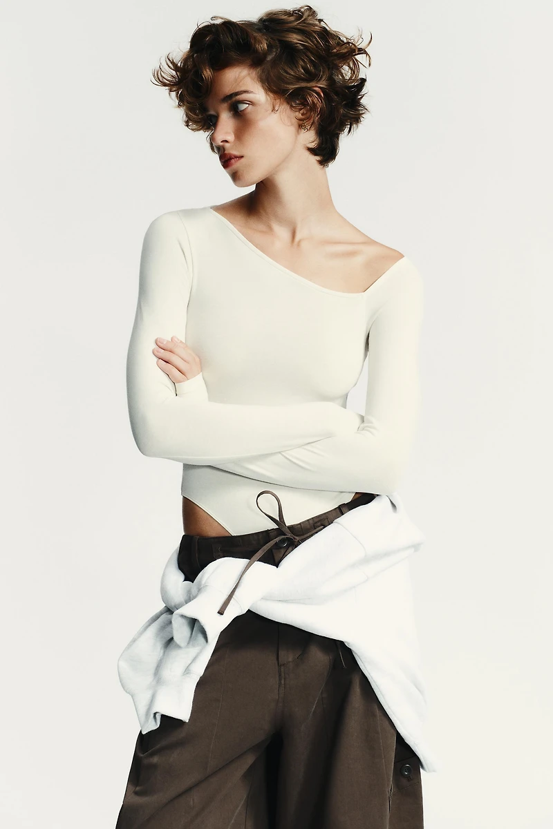 ASYMMETRIC LONG SLEEVE BODYSUIT