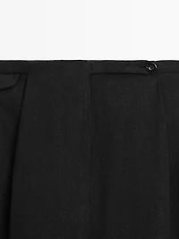 Flowing linen blend trousers with pocket details