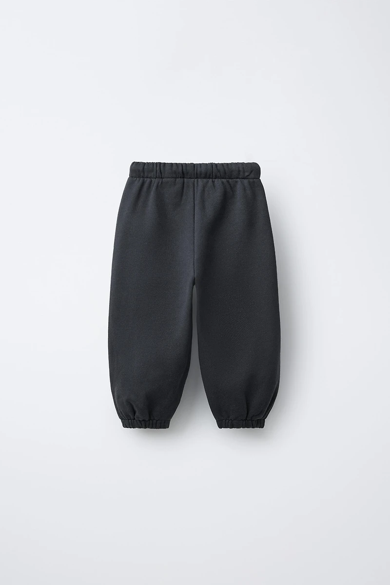 PANTALON JOGGER INSCRIPTION FLOCK