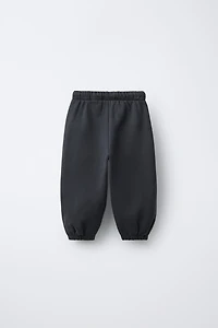 PANTALON JOGGER INSCRIPTION FLOCK