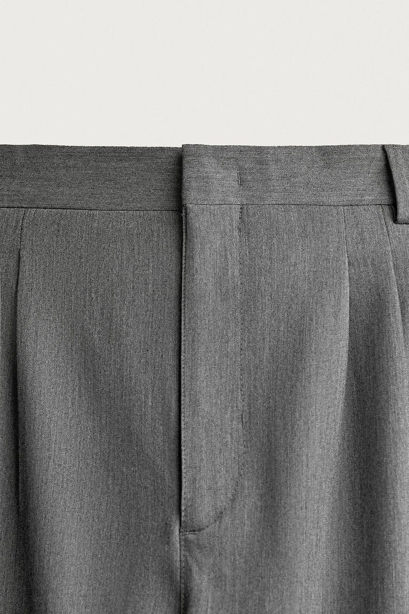 WIDE-FIT PLEATED TROUSERS
