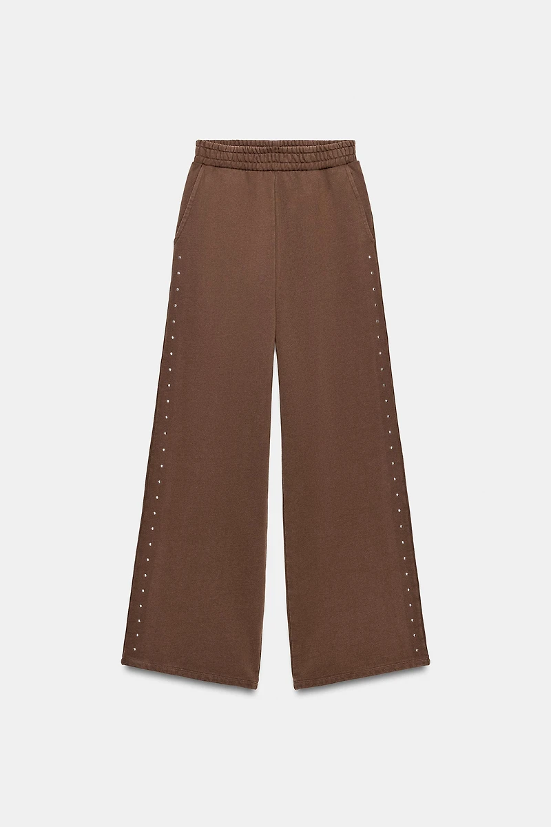 PANTALON EN MOLLETON EFFET DÉLAVÉ CLOUS