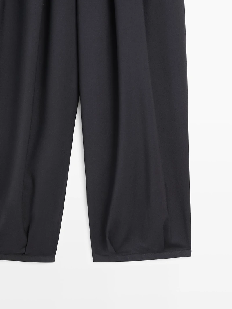 Voluminous wide-leg pleated trousers