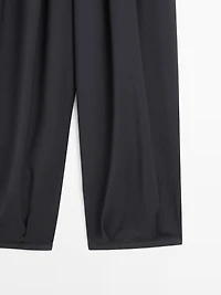 Voluminous wide-leg pleated trousers