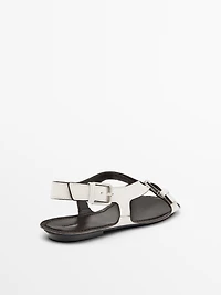 Flat leather sandals with buckles