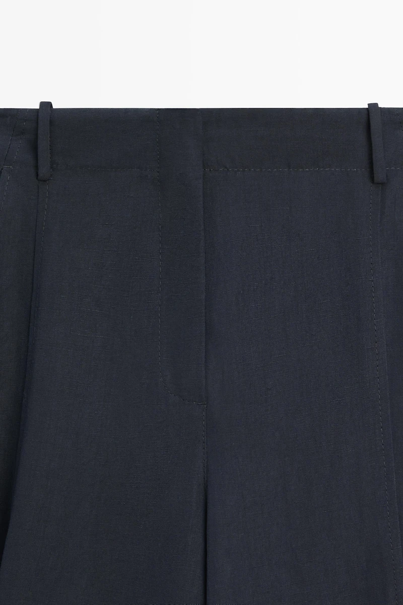 Flowing linen blend pants with buttoned tab detail