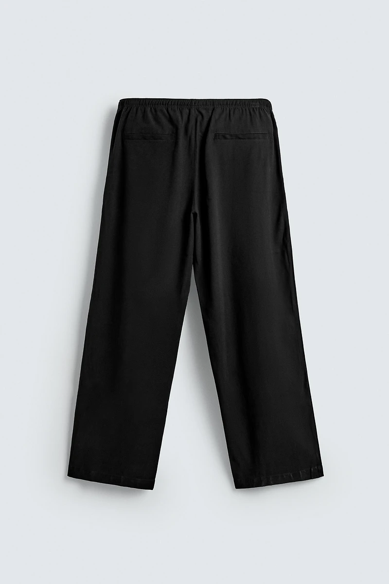 RELAXED FIT FLOWY PANTS
