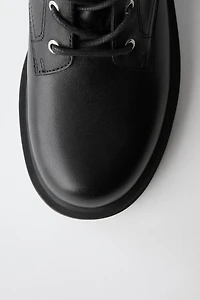 BOTTES EN CUIR À DOUBLE BOUCLE