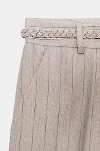 PANTALON CHEVRON AVEC CEINTURE TRESSÉE