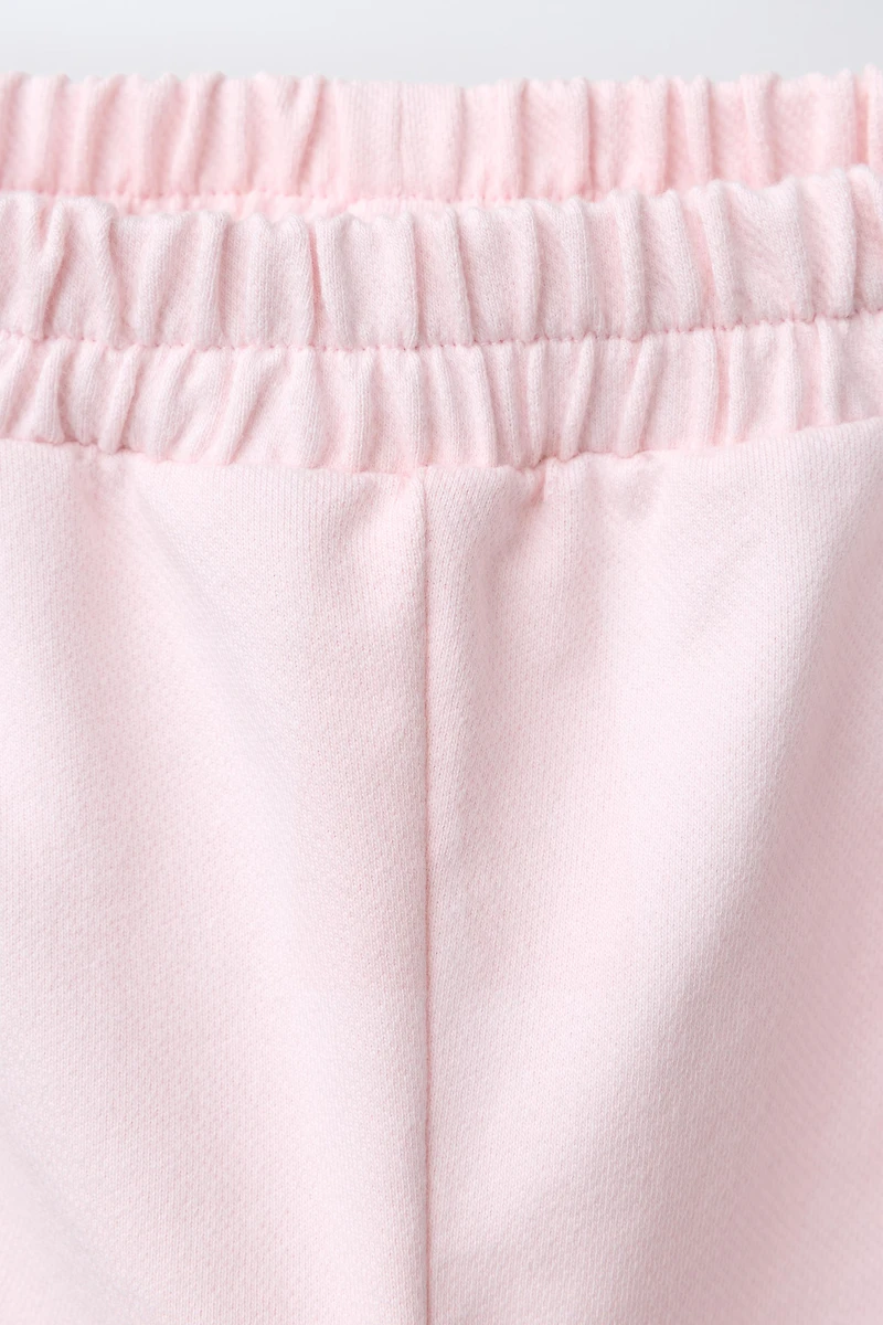 PANTALON À PINCES CŒURS