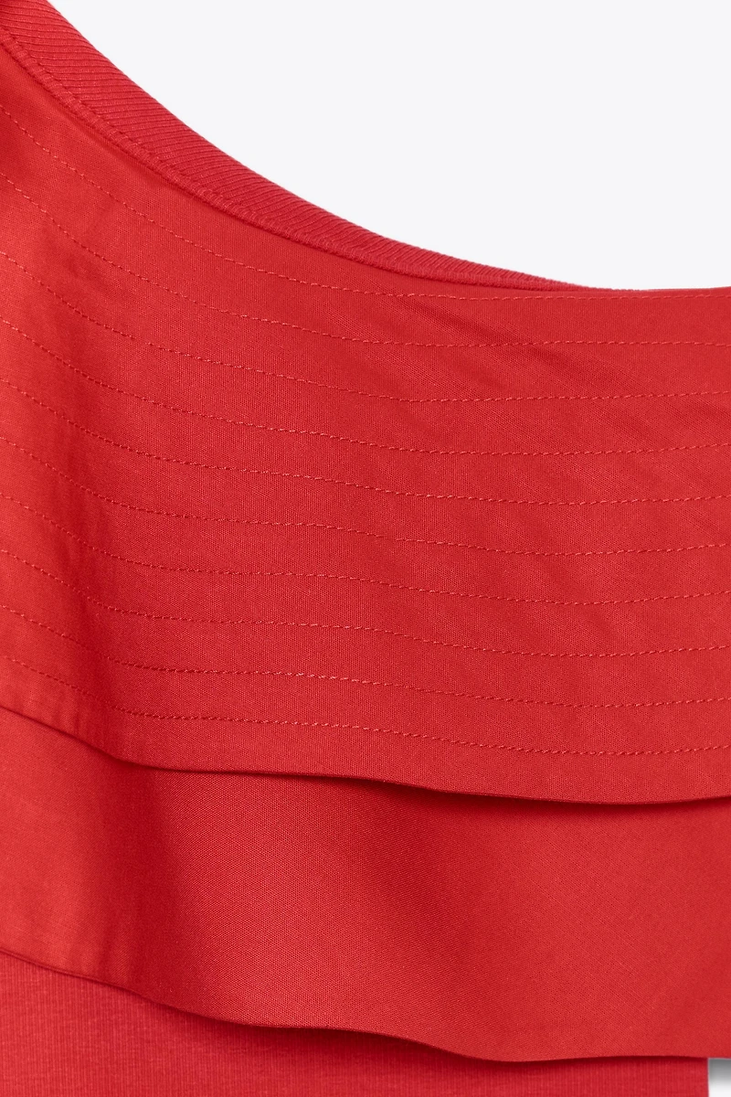 ASYMMETRIC BODYSUIT WITH CONTRASTING RUFFLE