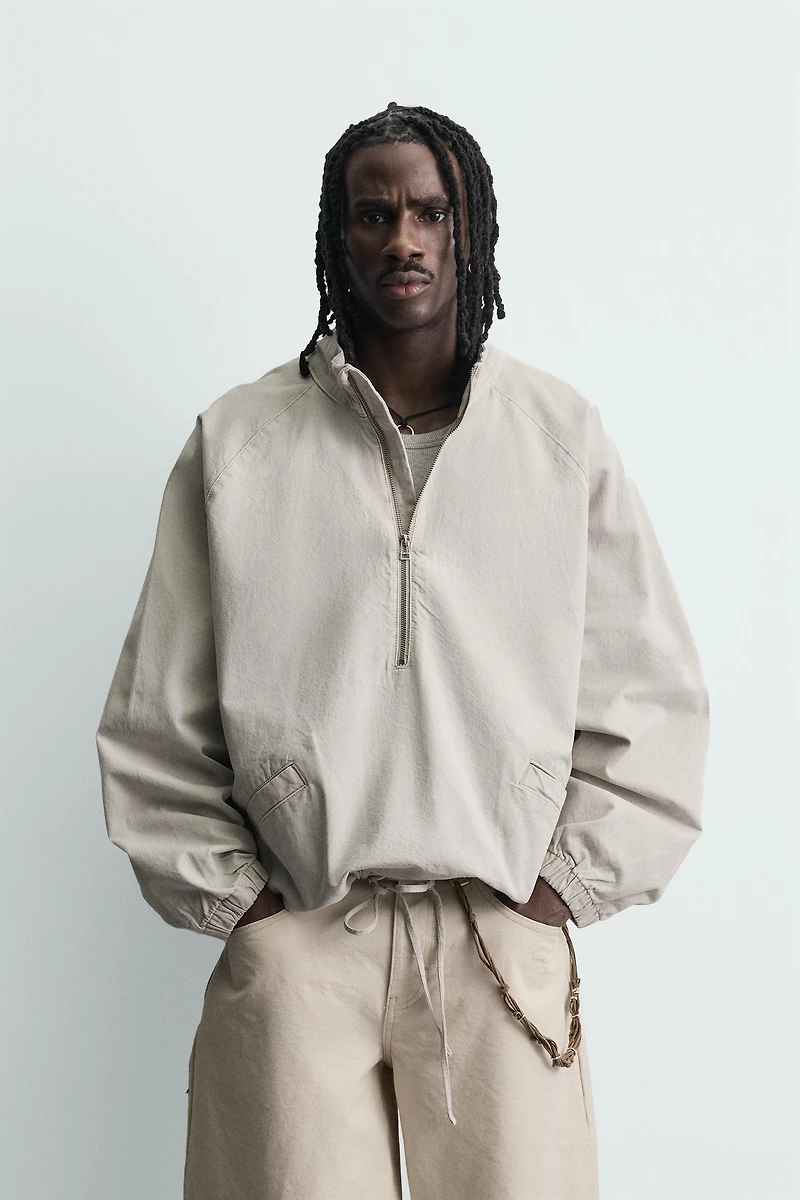 ZIPPERED POUCH POCKET SWEATSHIRT