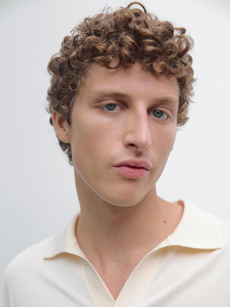 Knit sweater with a polo collar